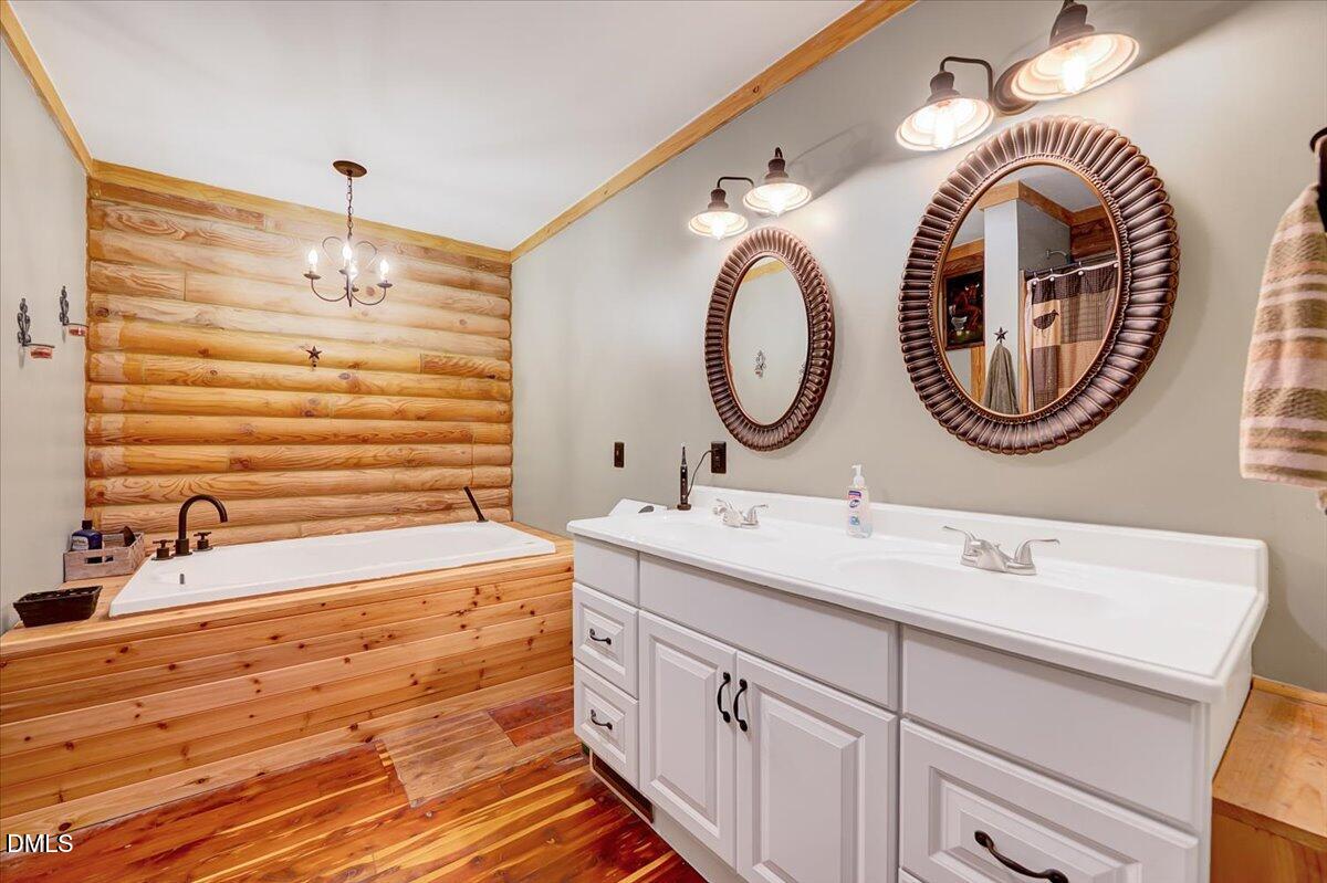 8545 Grassy Creek Road Oxford, NC 27565 - Photo 23 of 39 a bathroom with a sink and a mirror