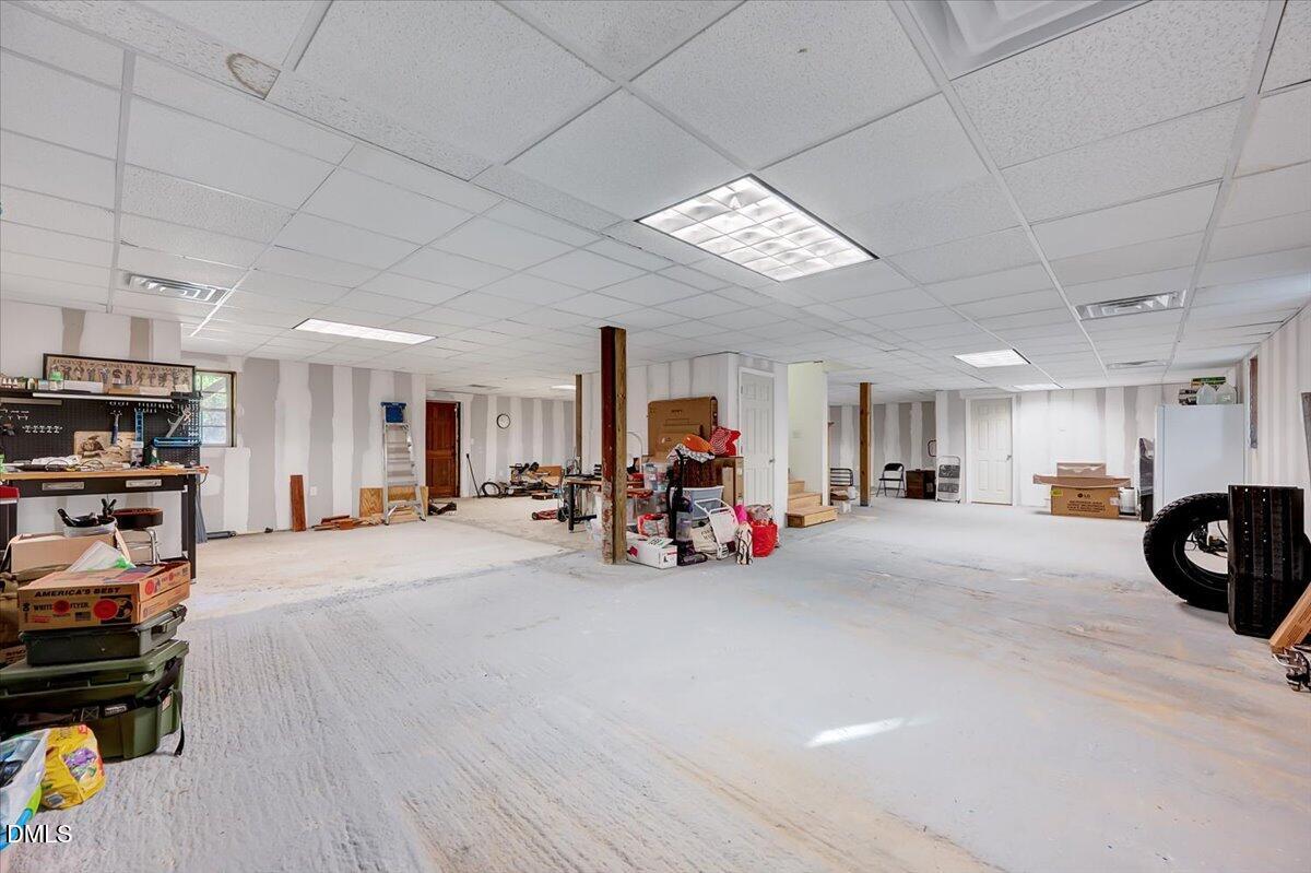 8545 Grassy Creek Road Oxford, NC 27565 - Photo 27 of 39 a view of a livingroom with furniture and a garage
