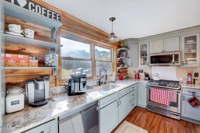 a kitchen with a stove and a sink