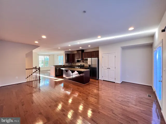 a view of kitchen with furniture and wooden floor