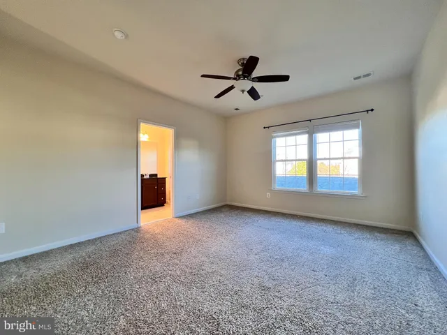 a view of empty room with windows