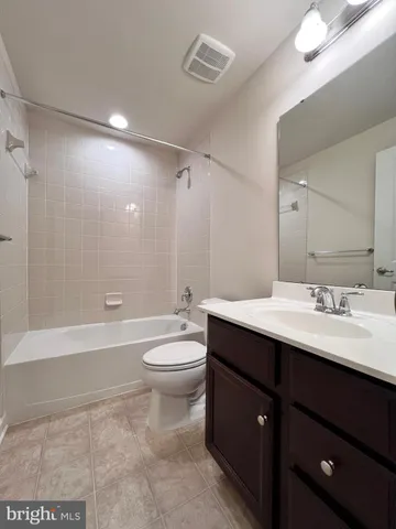 a view of a house with backyard and deck