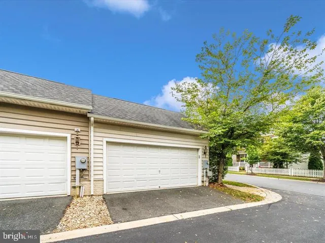 a view of a garage with a tree