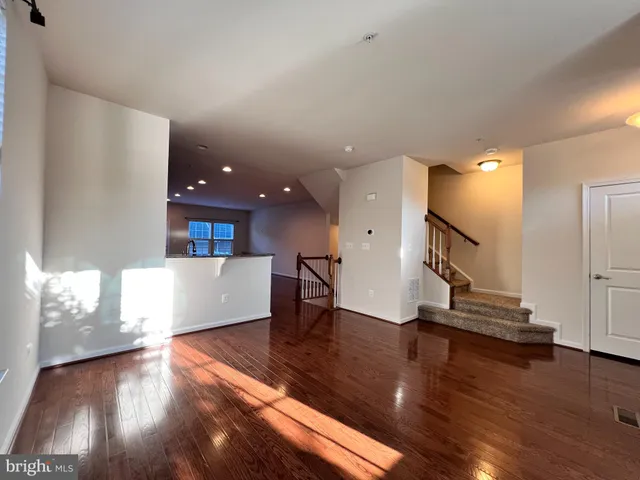 a view of a living room and wooden floor