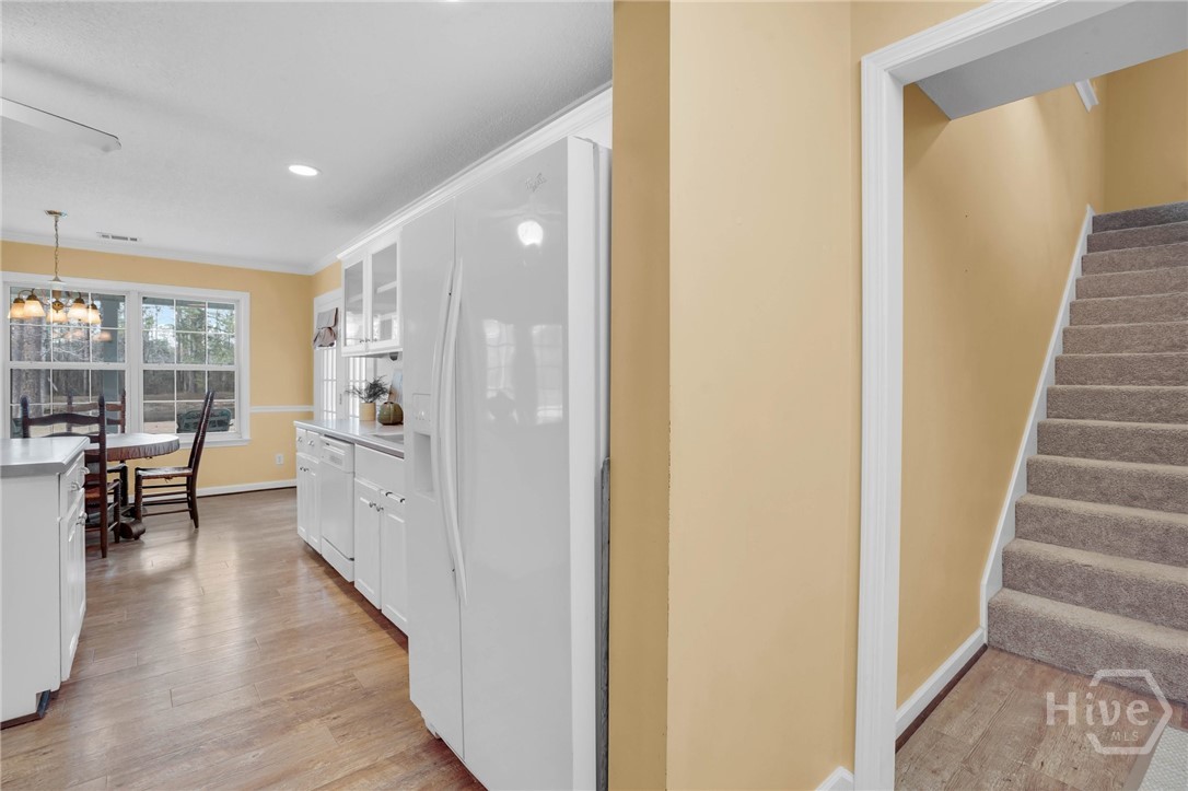 548 Sand Hill Road Brooklet, GA 30415 - Photo 22 of 44 Rear Staircase to Bonus- Connects to Secondary Bedrooms