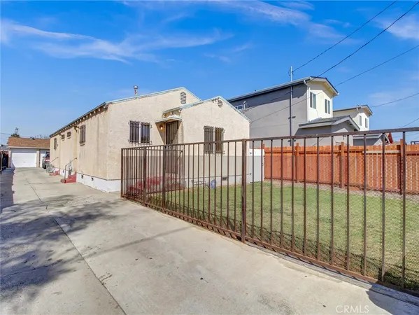 a view of a wrought iron fences in front of house