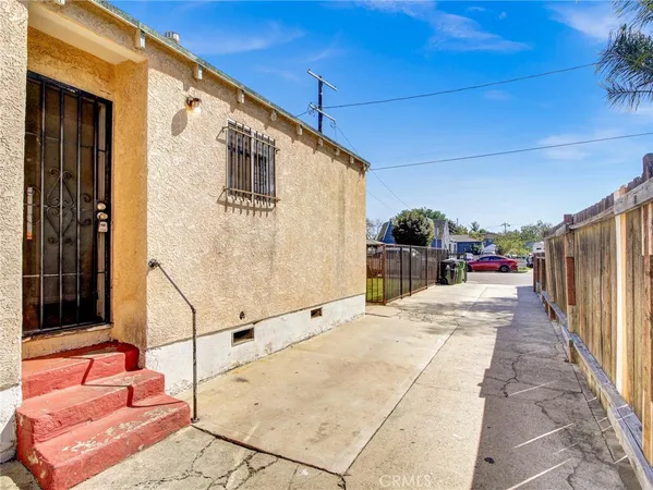 a view of balcony with wooden floor and seating space