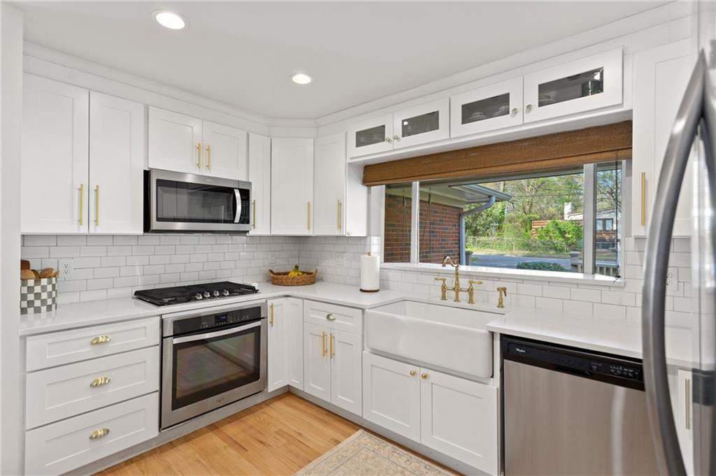 3371 King Springs Road Southeast Smyrna, GA 30080 - Photo 13 of 48 a kitchen with a sink stove and microwave
