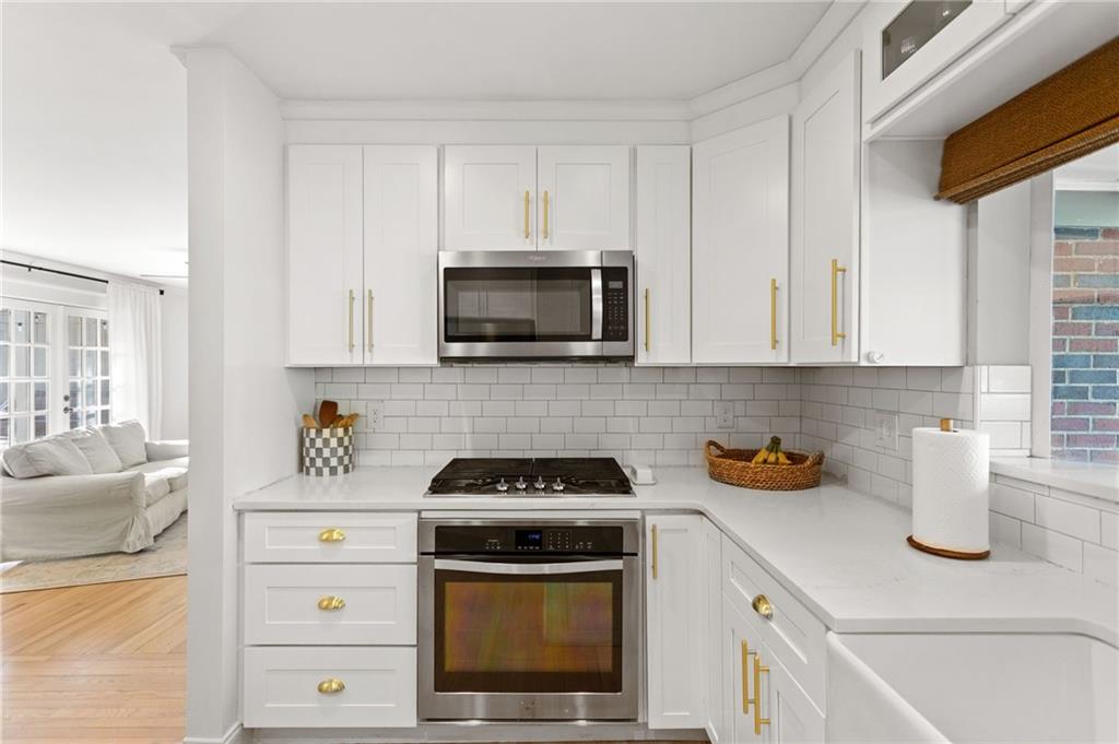 3371 King Springs Road Southeast Smyrna, GA 30080 - Photo 14 of 48 a kitchen with a stove and a microwave