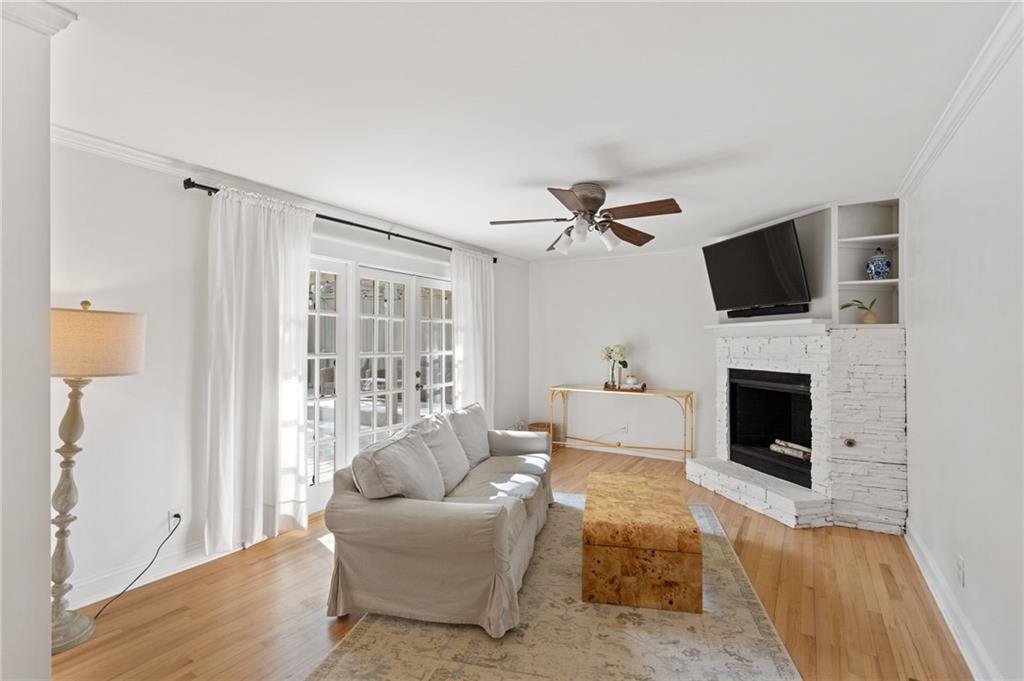 3371 King Springs Road Southeast Smyrna, GA 30080 - Photo 15 of 48 a living room with furniture a fireplace and a flat screen tv
