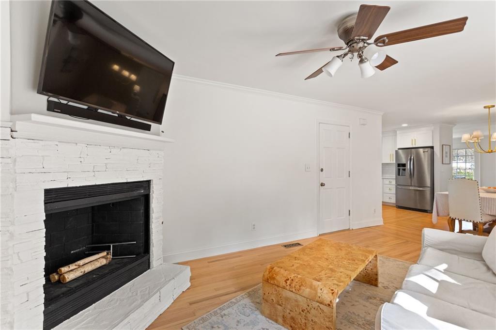 3371 King Springs Road Southeast Smyrna, GA 30080 - Photo 16 of 48 a living room with a flat screen tv and a fireplace