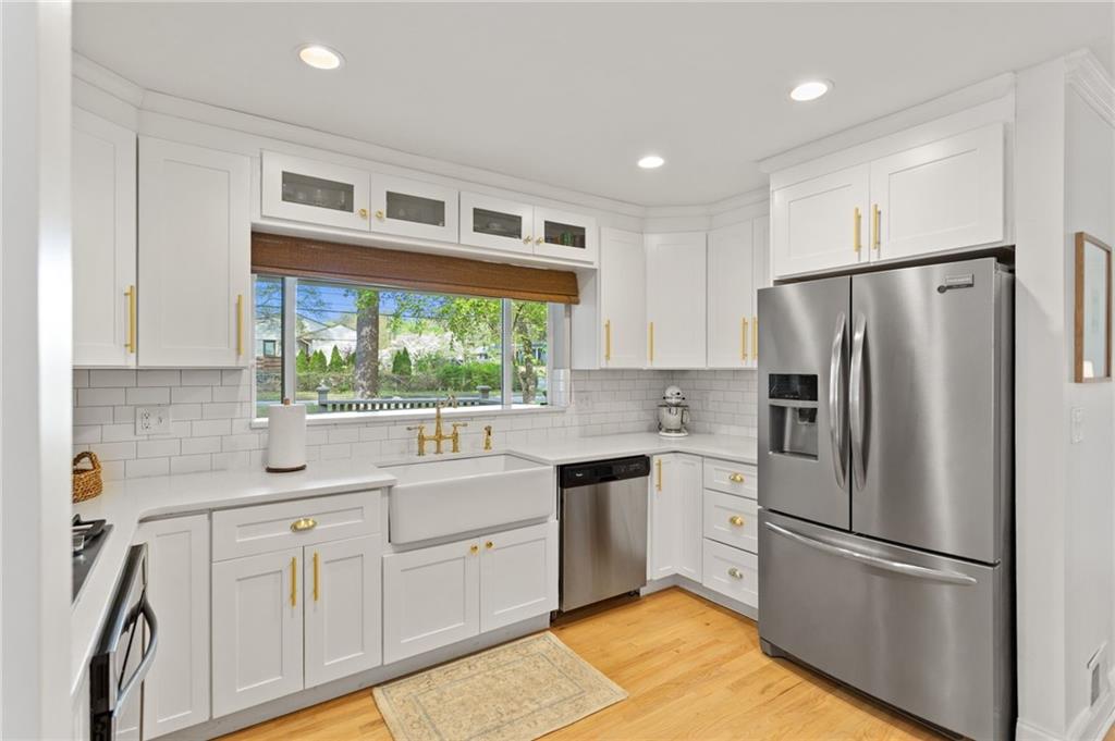 3371 King Springs Road Southeast Smyrna, GA 30080 - Photo 2 of 48 a kitchen with a refrigerator a sink and cabinets