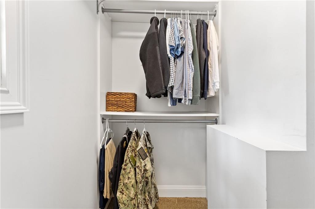 3371 King Springs Road Southeast Smyrna, GA 30080 - Photo 35 of 48 a close view of walk in closet with clothes