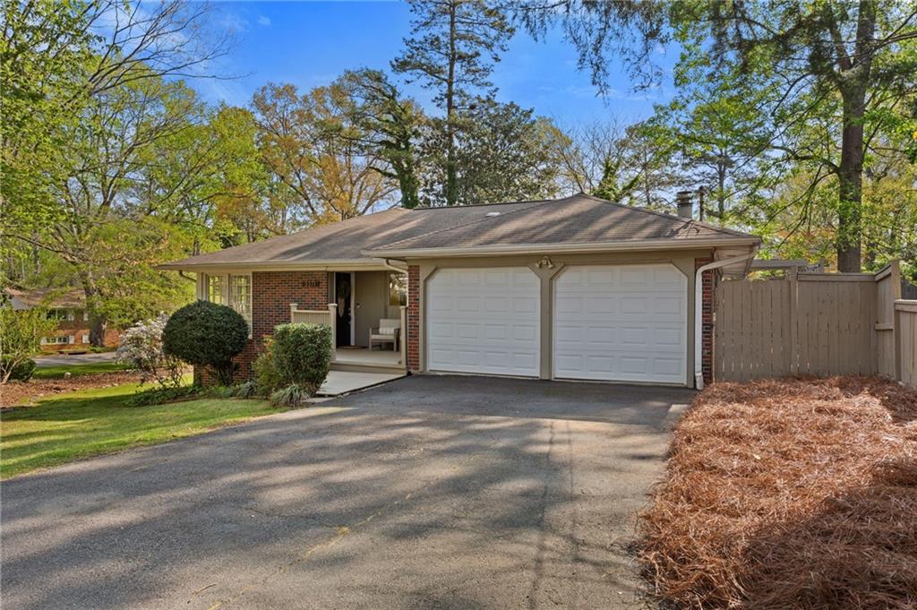 3371 King Springs Road Southeast Smyrna, GA 30080 - Photo 45 of 48 a front view of a house with a garden