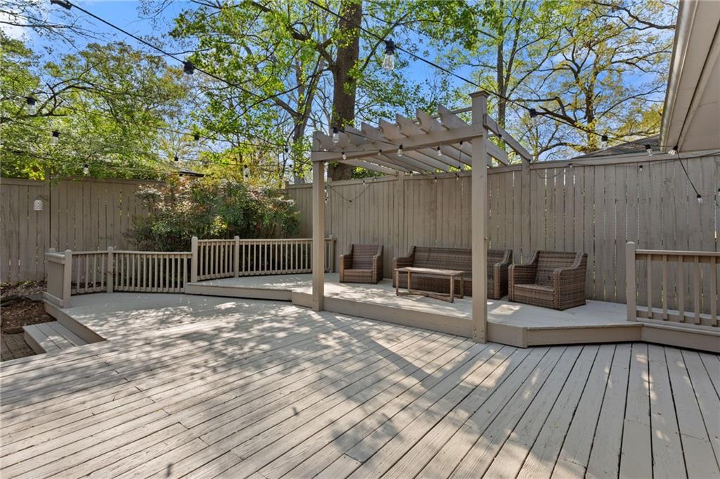 3371 King Springs Road Southeast Smyrna, GA 30080 - Photo 5 of 48 a view of a deck with furniture and wooden floor