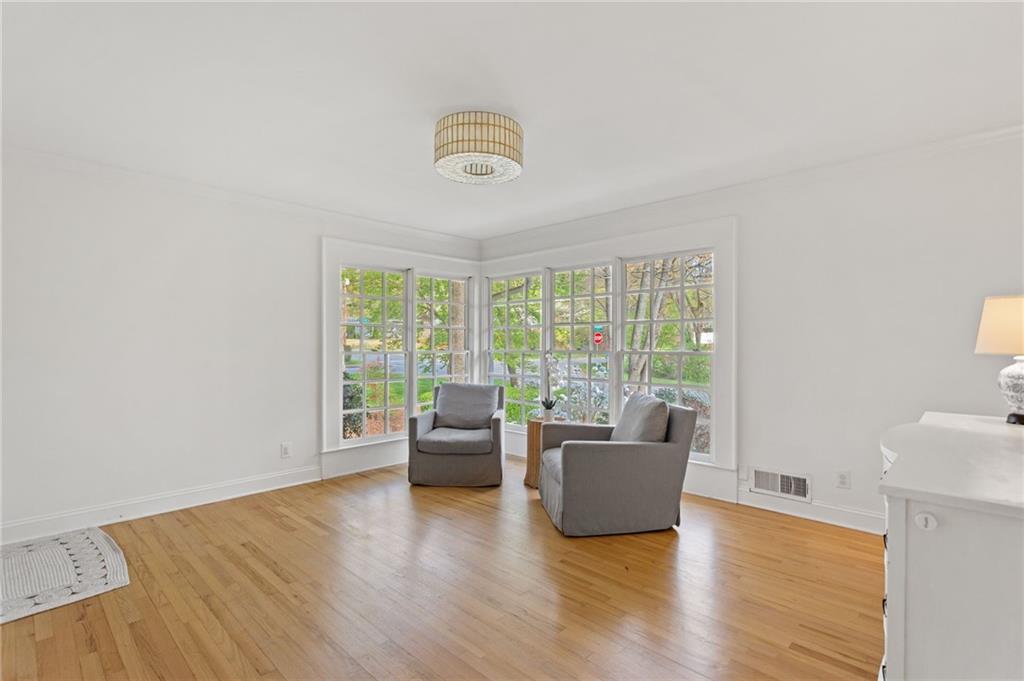 3371 King Springs Road Southeast Smyrna, GA 30080 - Photo 7 of 48 a living room with furniture and a large window