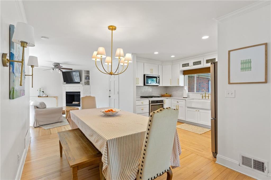 3371 King Springs Road Southeast Smyrna, GA 30080 - Photo 10 of 48 a large kitchen with a table and chairs in it