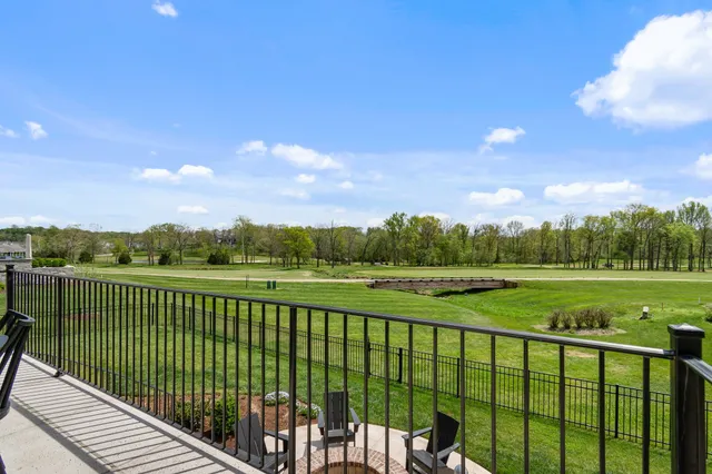 a view of a patio with table and chairs and potted plants