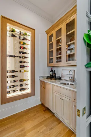 a kitchen with a stove and a wooden floor