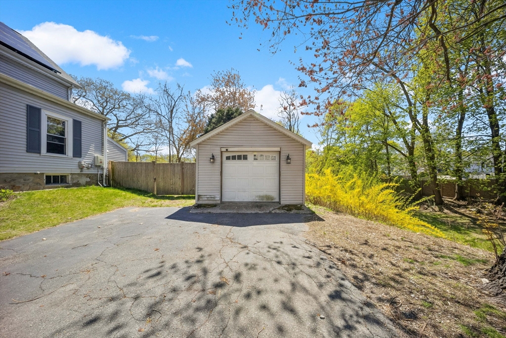 46 Appleton Street Saugus, MA 01906 - Photo 12 of 42 a front view of a house with a yard and garage