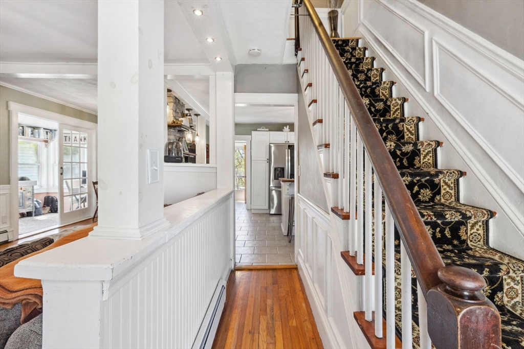 46 Appleton Street Saugus, MA 01906 - Photo 16 of 42 a view of a hallway with wooden floor and staircase