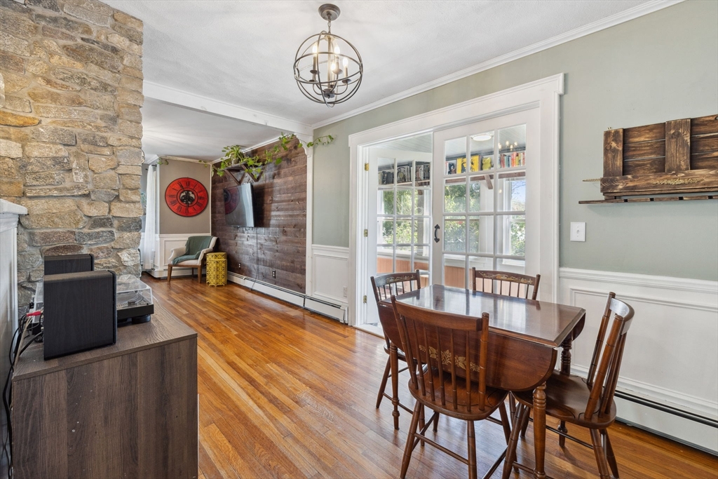 46 Appleton Street Saugus, MA 01906 - Photo 21 of 42 a view of a dining room with furniture wooden floor and chandelier
