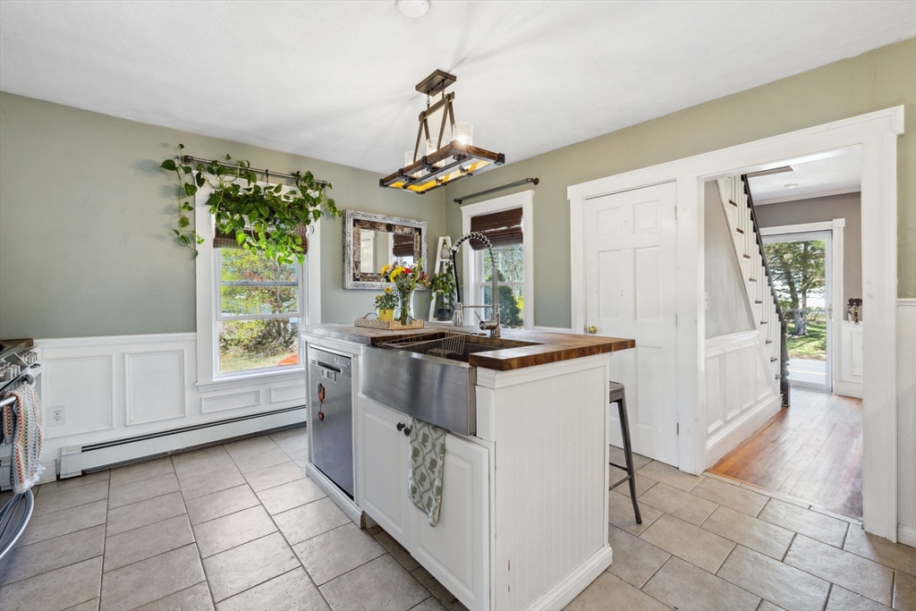 46 Appleton Street Saugus, MA 01906 - Photo 24 of 42 a kitchen with granite countertop a sink and a stove