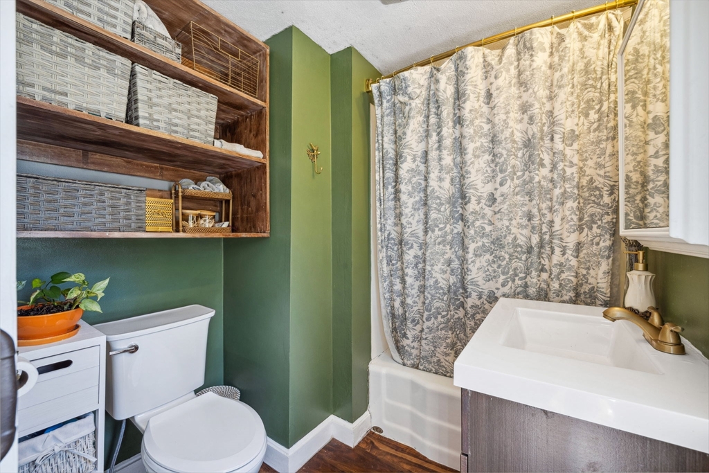 46 Appleton Street Saugus, MA 01906 - Photo 30 of 42 a bathroom with a sink a toilet and shower