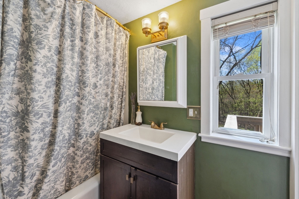 46 Appleton Street Saugus, MA 01906 - Photo 31 of 42 a bathroom with a sink and a mirror