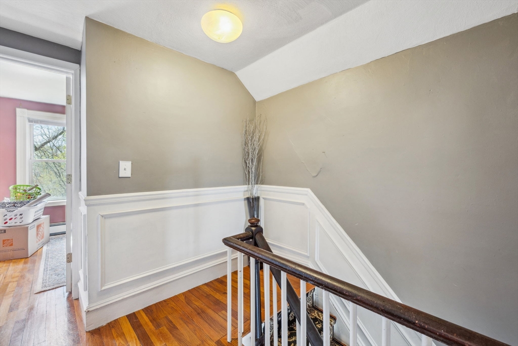 46 Appleton Street Saugus, MA 01906 - Photo 34 of 42 a view of a hallway with wooden floor and stairs