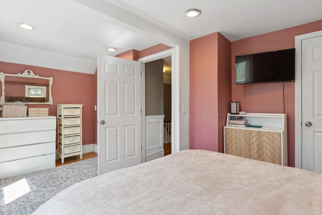 46 Appleton Street Saugus, MA 01906 - Photo 40 of 42 a bedroom with a bed and a flat screen tv