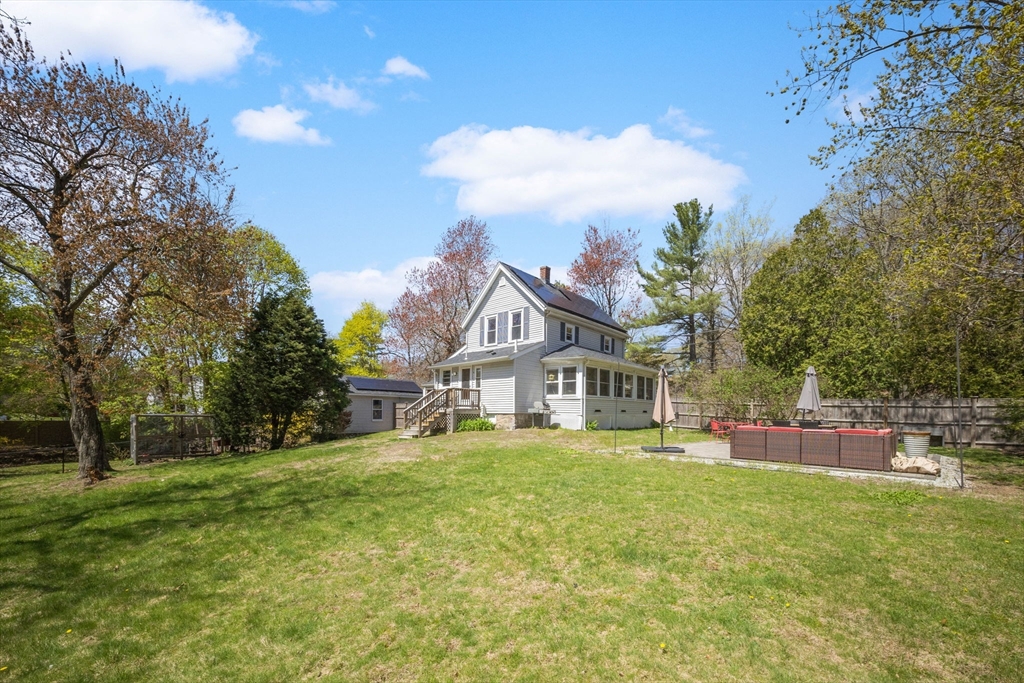46 Appleton Street Saugus, MA 01906 - Photo 9 of 42 a view of a house with a big yard and a large tree