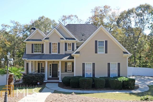 6060 Julian Road, Unit 21 Gainesville, GA 30506 - Photo 1 of 1 a front view of a house with a yard outdoor seating and garage