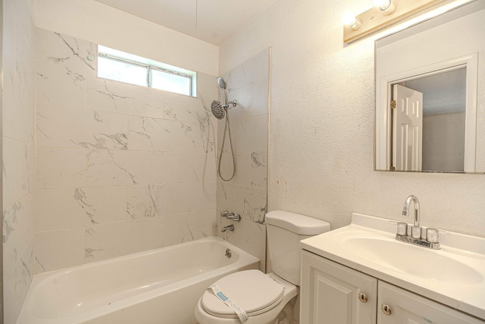 14626 North 38th Street Phoenix, AZ 85032 - Photo 5 of 13 a bathroom with a sink toilet and shower