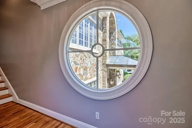 a spacious bedroom with a large bed and a large window