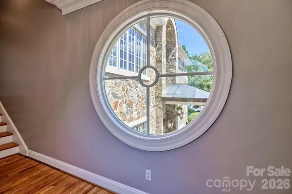 a spacious bedroom with a large bed and a large window