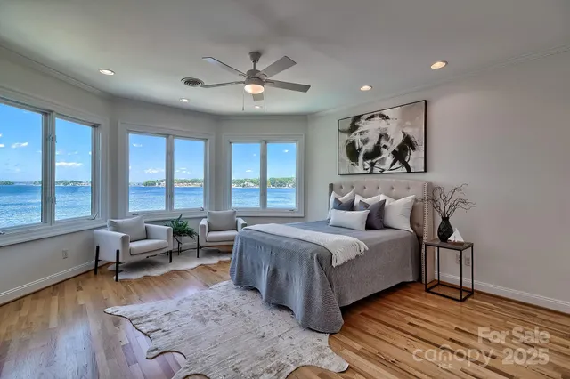 a bathroom with a granite countertop toilet sink and mirror