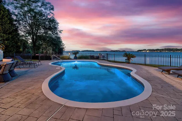 a view of swimming pool having outdoor seating