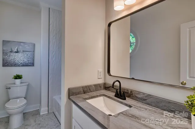 a bedroom with a large bed and a large window