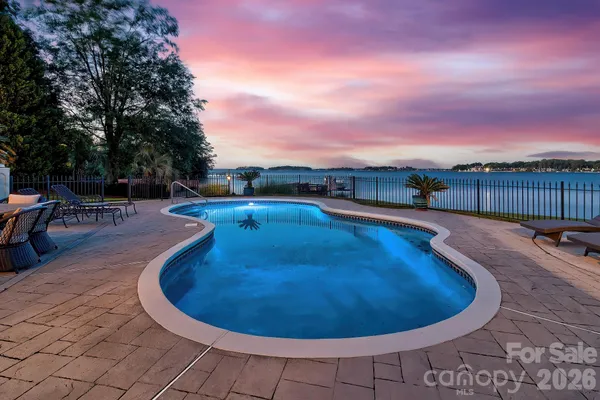 a view of swimming pool having outdoor seating