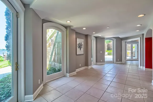 a bathroom with a toilet sink vanity and mirror