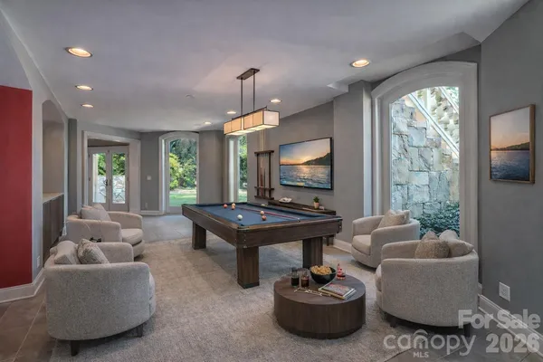 a bathroom with a toilet sink vanity and mirror