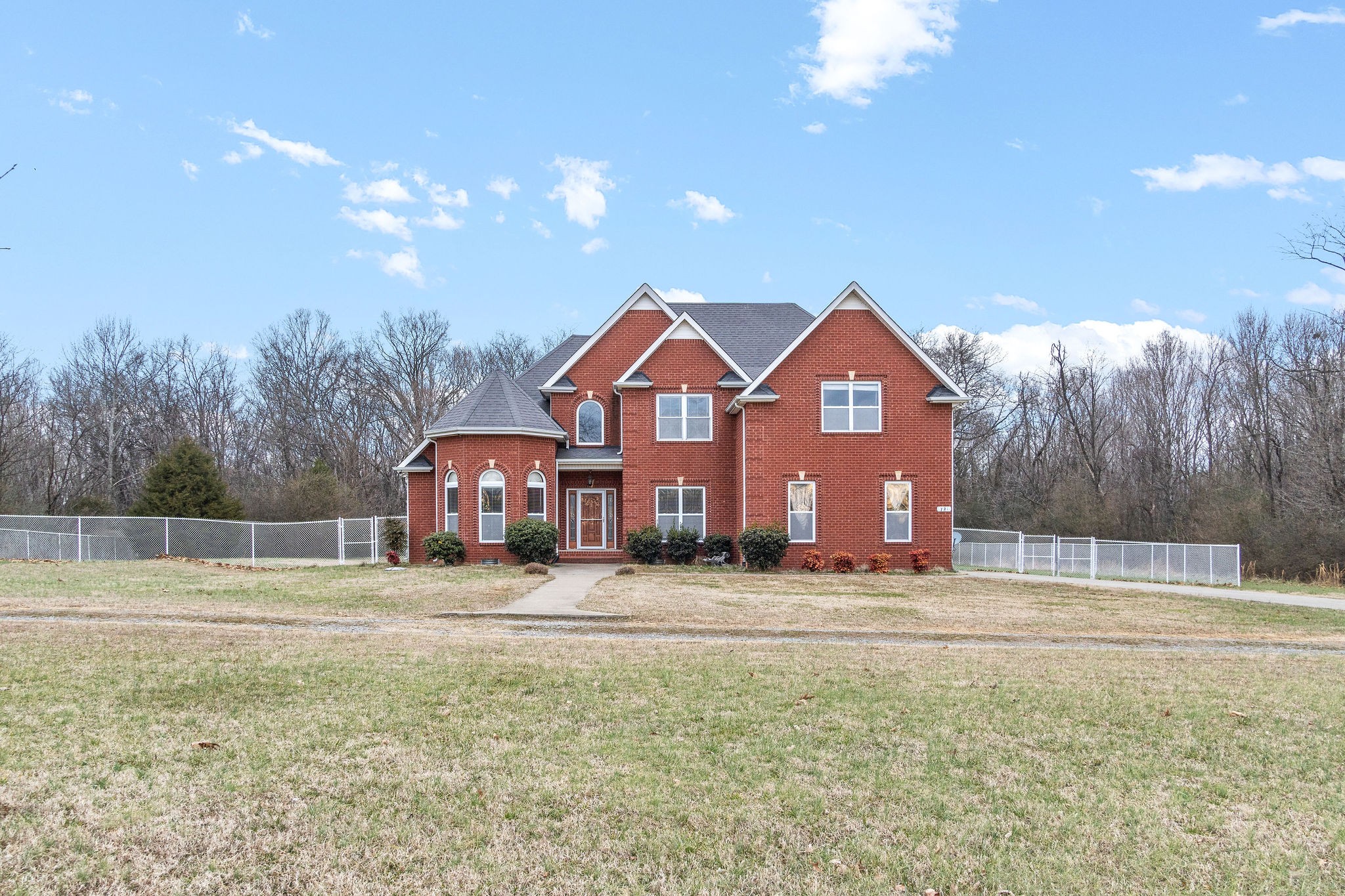 721 Needmore Road Clarksville, TN 37040 - Photo 2 of 40 a front view of a house with a yard and garage