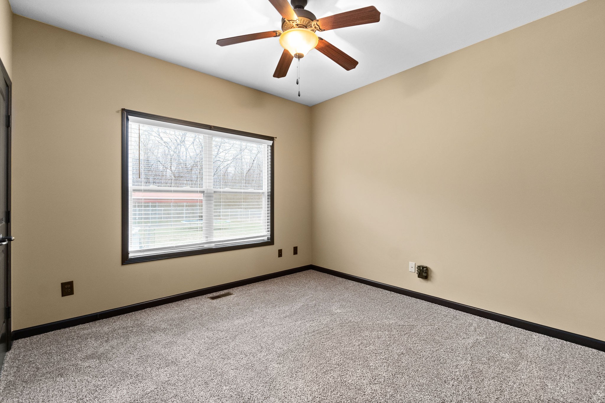 721 Needmore Road Clarksville, TN 37040 - Photo 27 of 40 an empty room with windows and fan