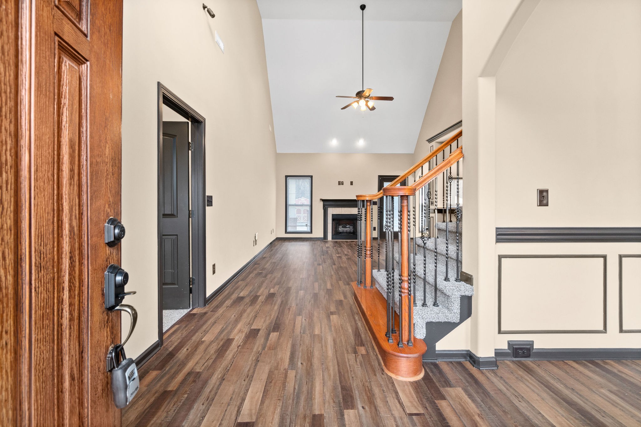 721 Needmore Road Clarksville, TN 37040 - Photo 5 of 40 a view of a hallway with wooden floor and staircase