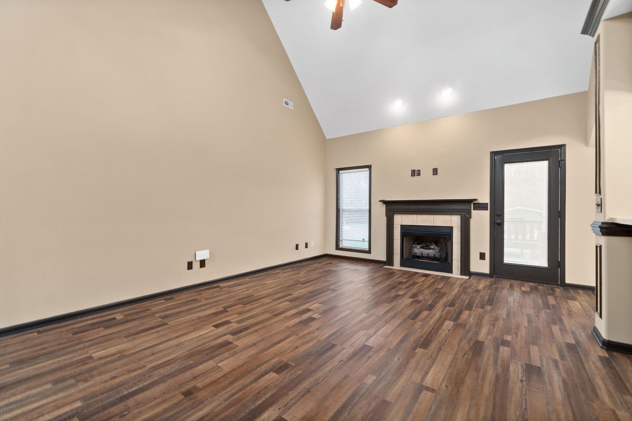 721 Needmore Road Clarksville, TN 37040 - Photo 7 of 40 a view of empty room with wooden floor and fireplace