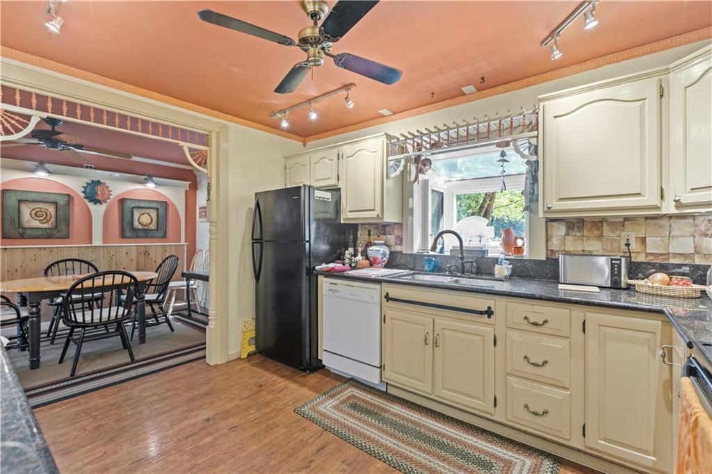 2172 Mercer Road New Brighton, PA 15066 - Photo 12 of 35 a kitchen with stainless steel appliances granite countertop a refrigerator and a sink