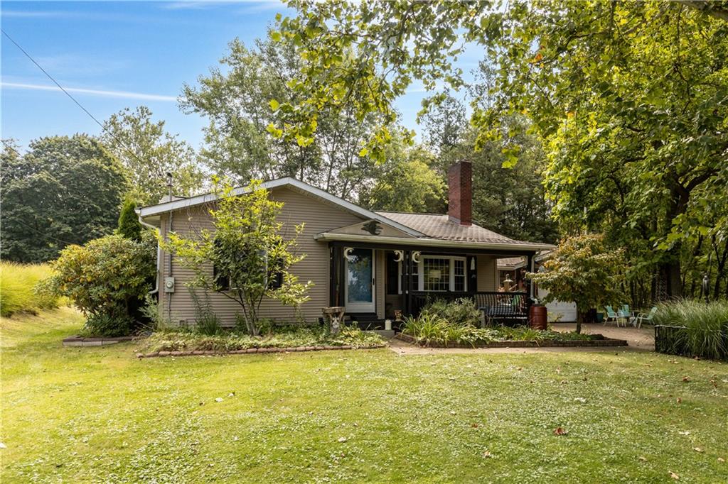 2172 Mercer Road New Brighton, PA 15066 - Photo 2 of 35 a front view of house with yard and trees around