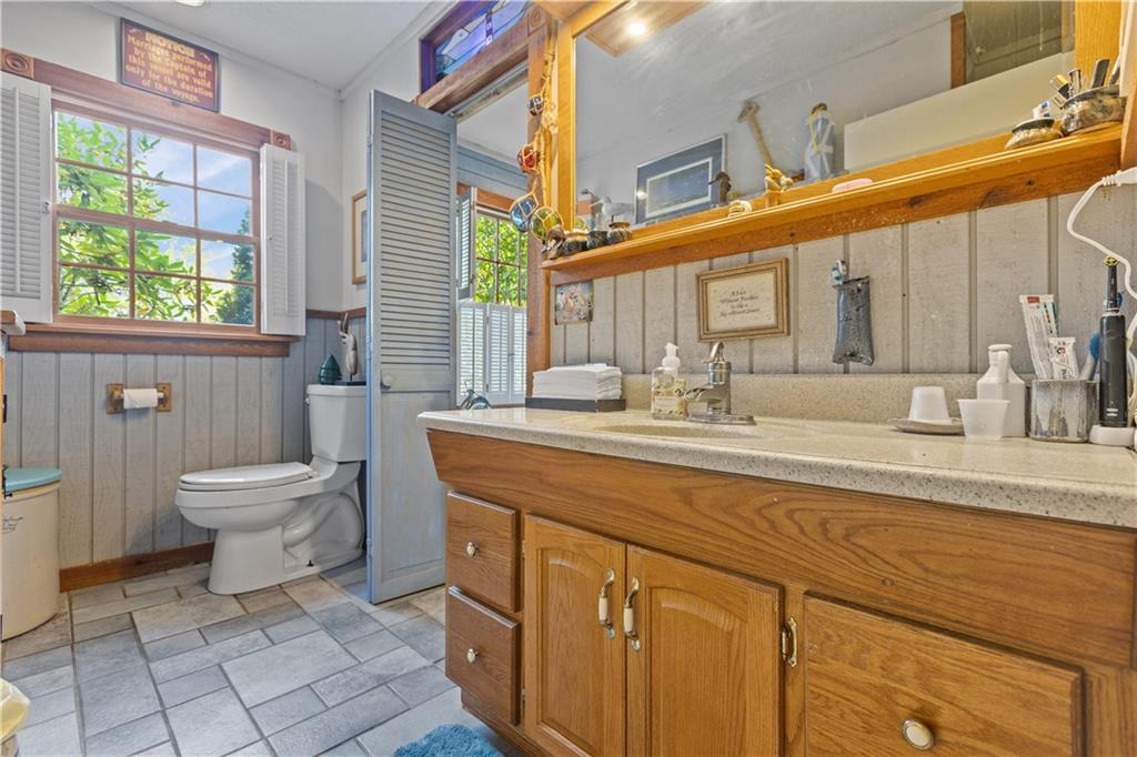 2172 Mercer Road New Brighton, PA 15066 - Photo 26 of 35 a bathroom with a toilet a sink and mirror