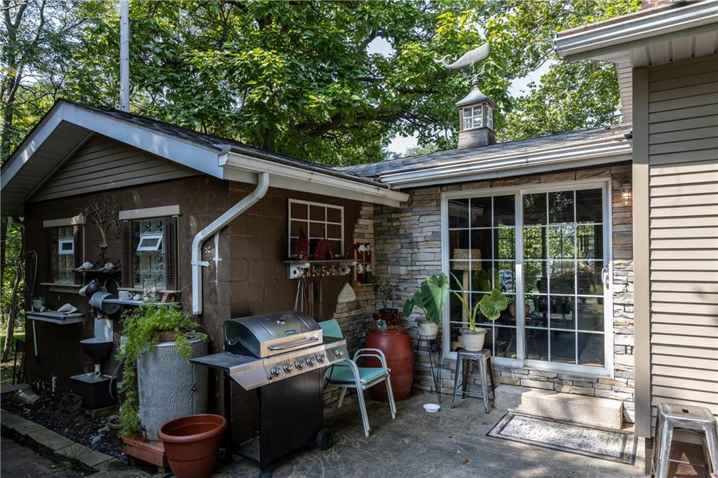 2172 Mercer Road New Brighton, PA 15066 - Photo 6 of 35 a view of a patio with table and chairs and potted plants